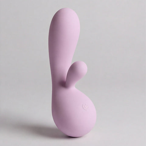 Purple silicone rabbit-shaped toy on a light gray background
