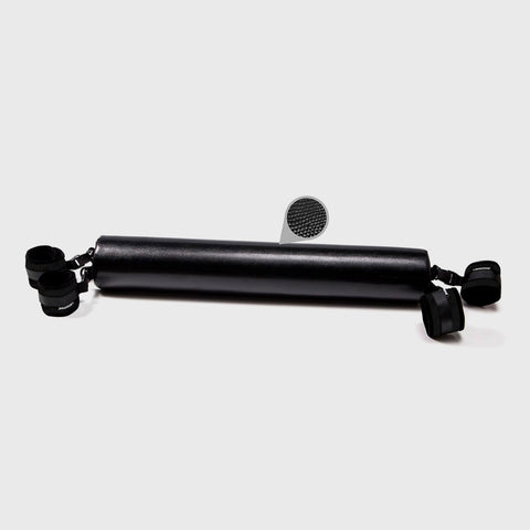 Black spreader bar with attachments on a white background