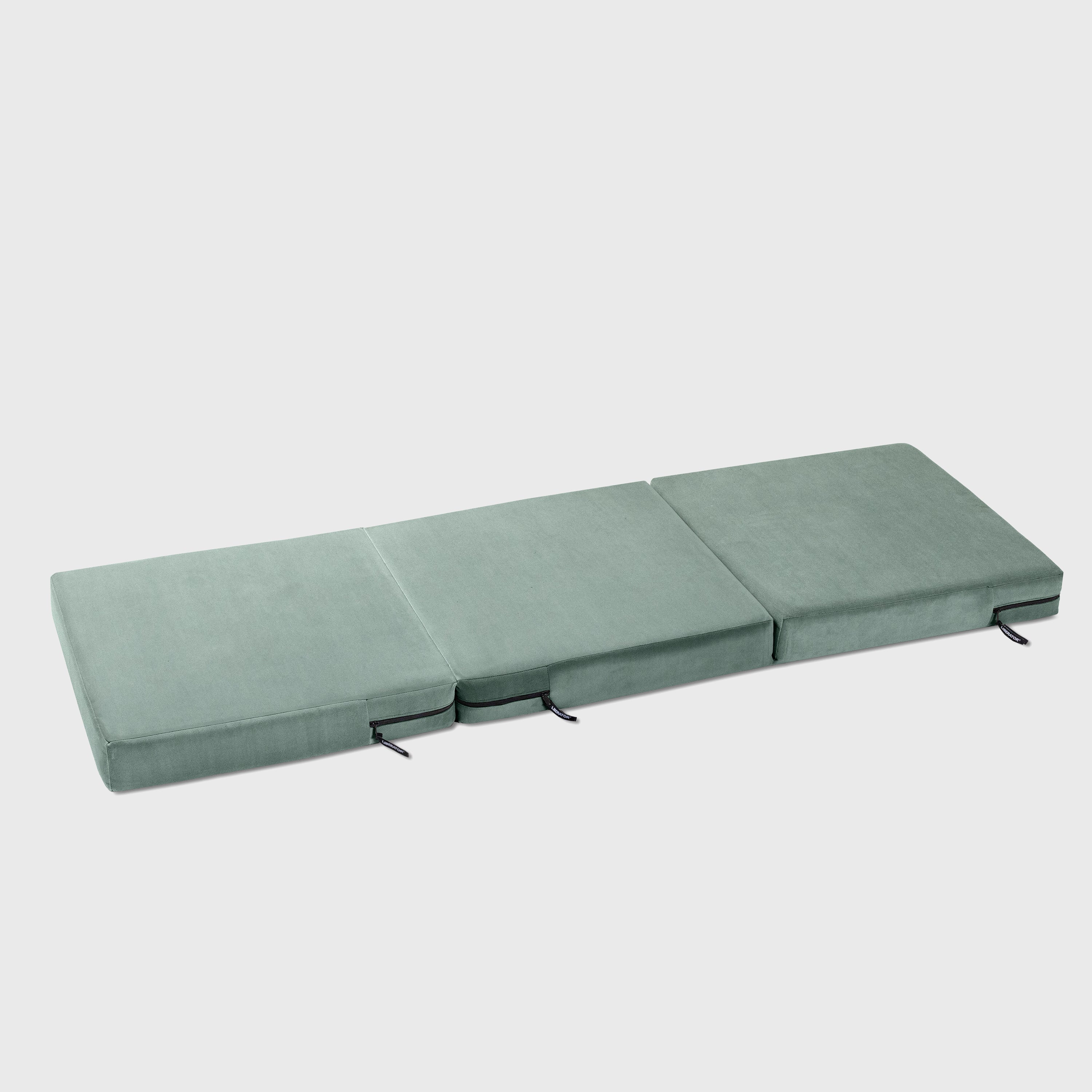 Teal folding mattress on a white background