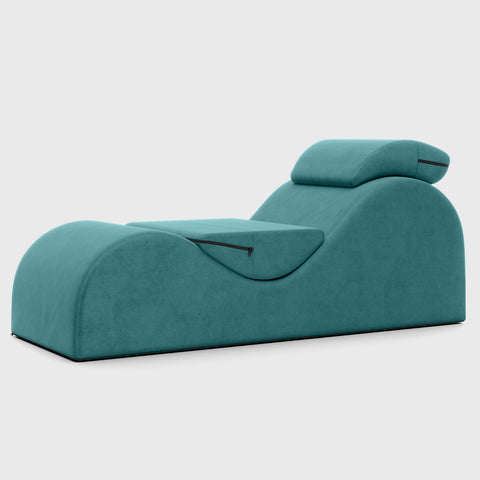 Teal lounge chair on a white background.