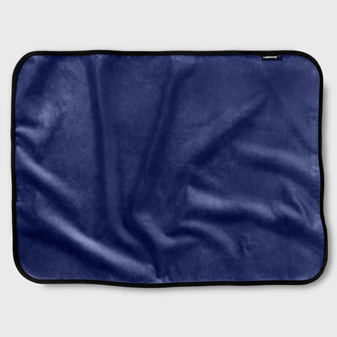 Navy blue satin fabric throw on a white background