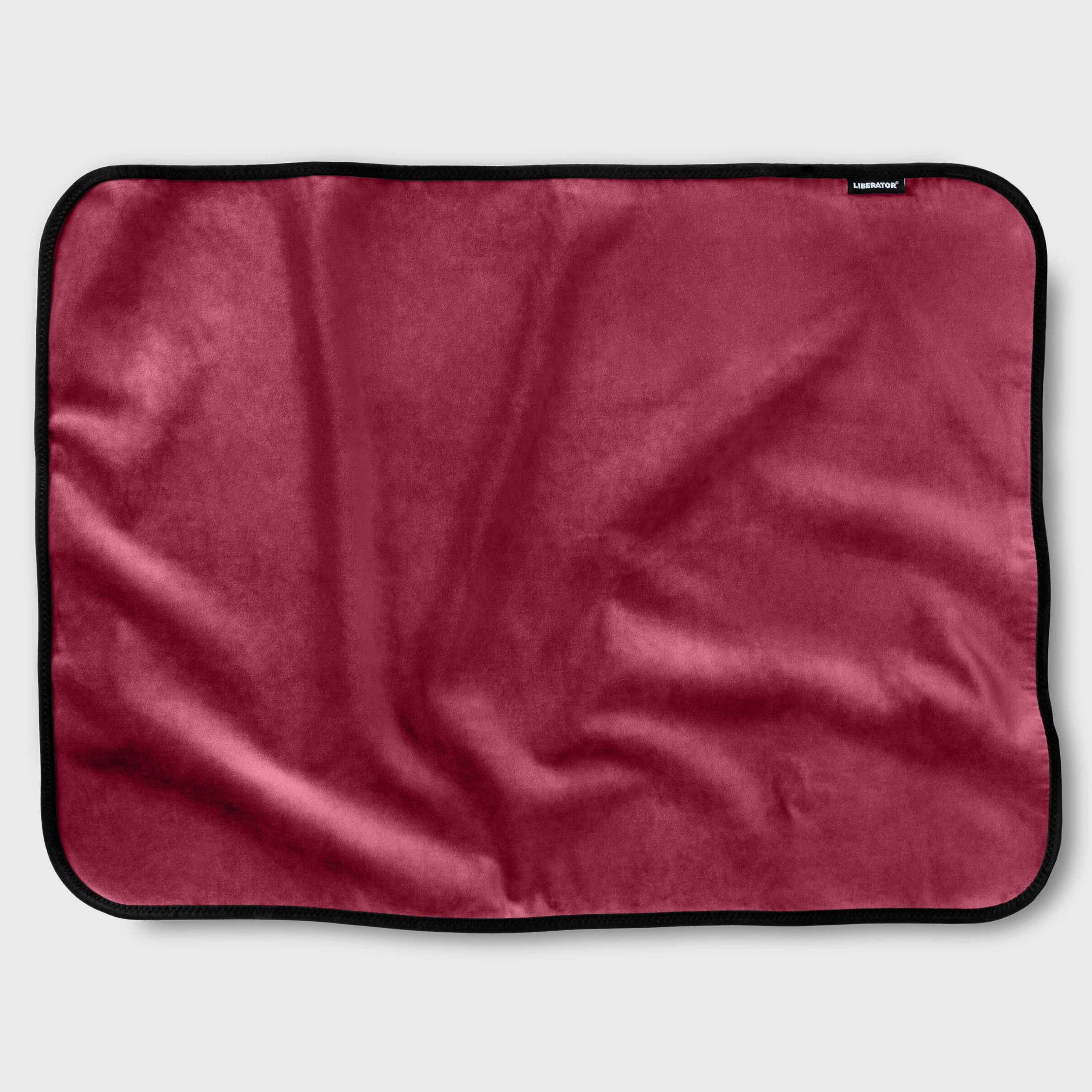 Red blanket with black border on a white background