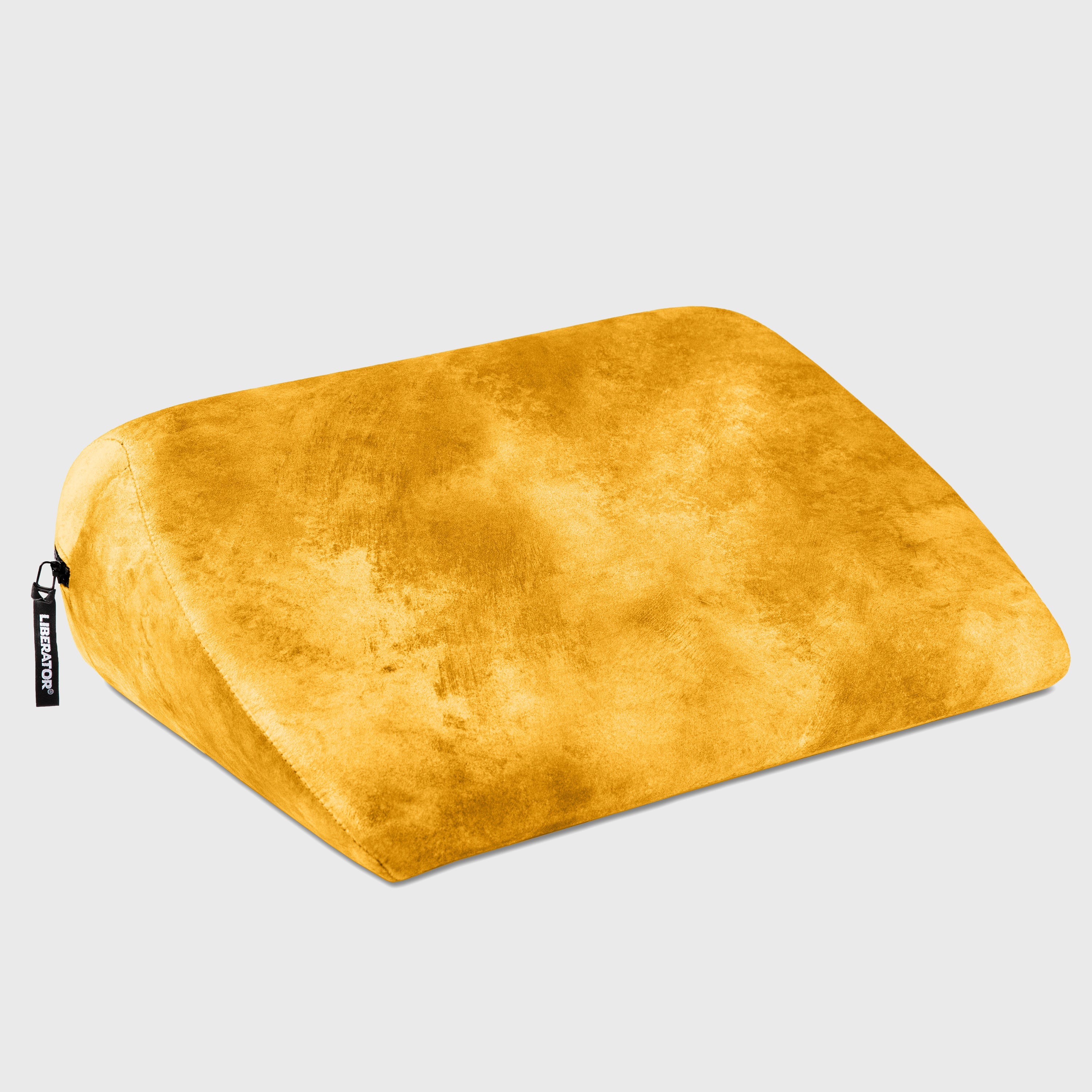 Yellow wedge pillow on a light gray background