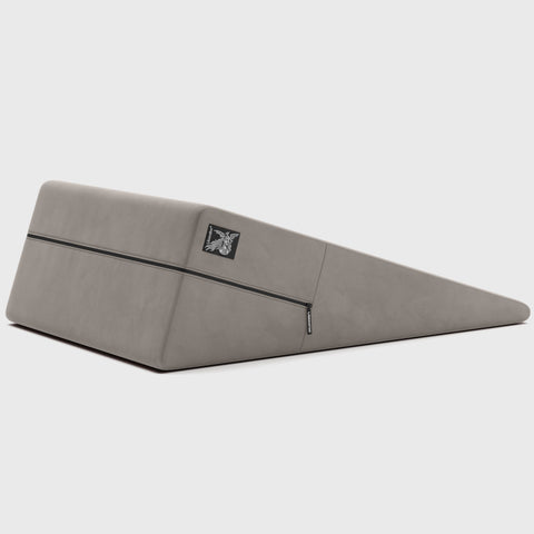 Gray ramp pillow with a brand logo on a white background