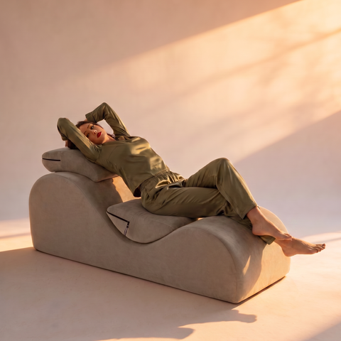 Woman in olive loungewear on the champagne Esse lounge chair