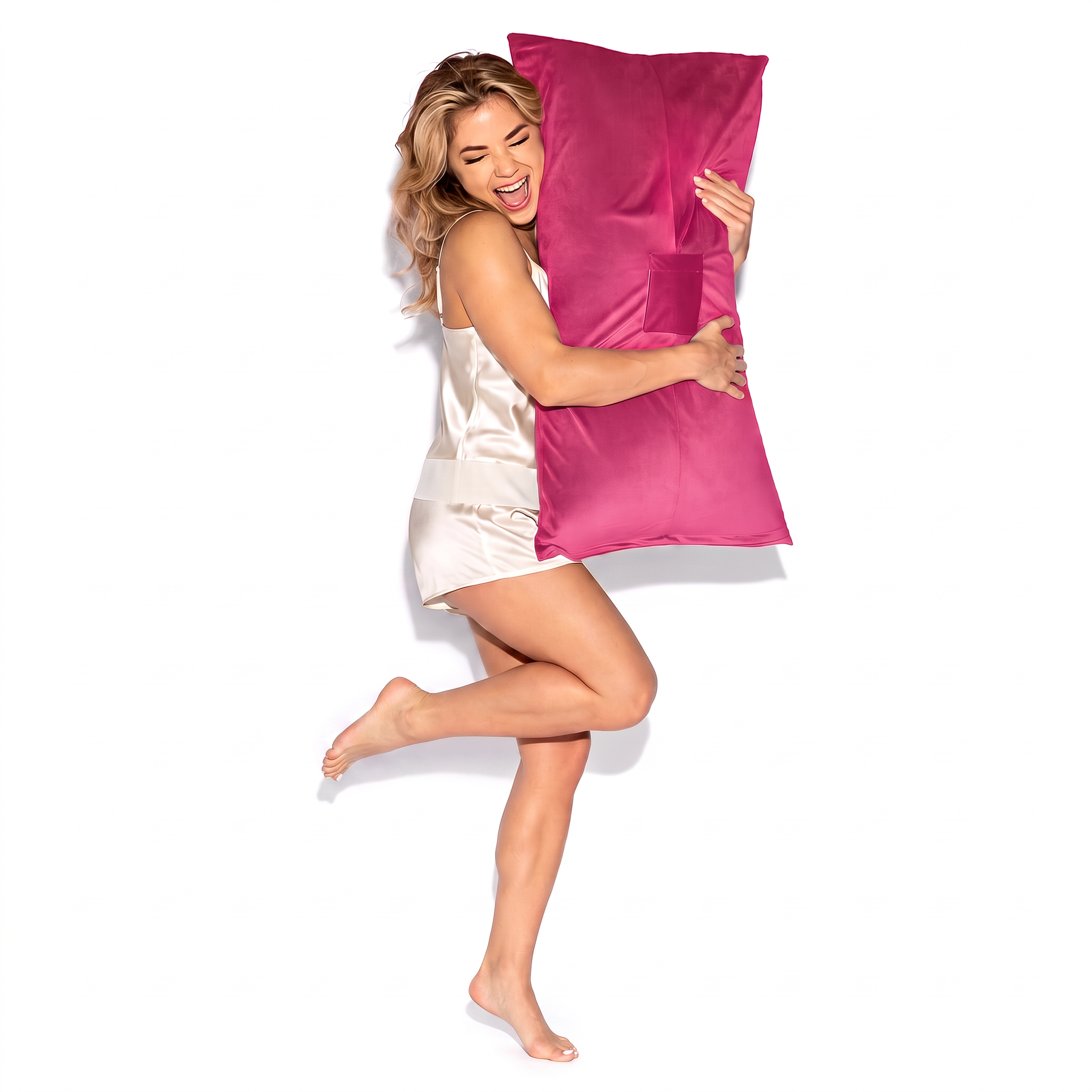 Humphrey toy-mount pillow in Hot Pink, held by a model in ivory satin sleepwear