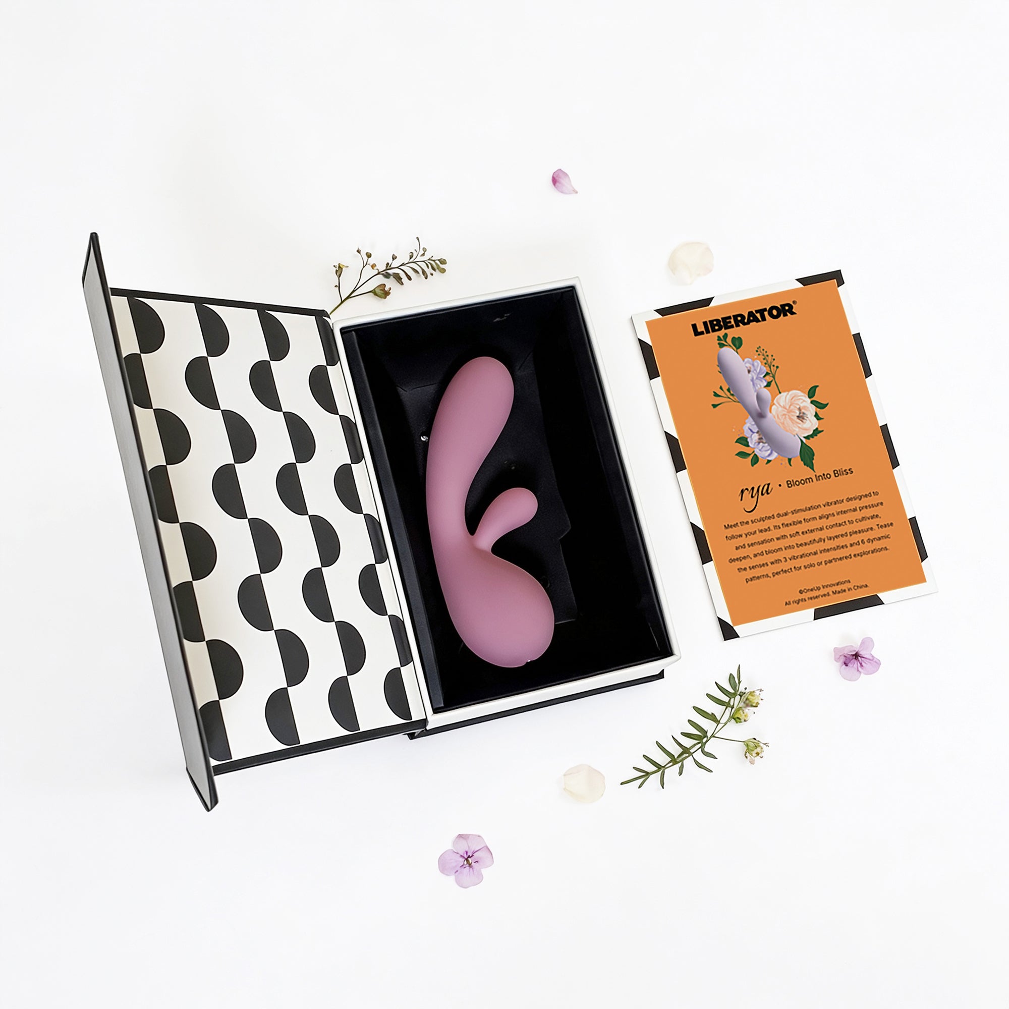 Pink toy in a patterned box with a card labeled 'Liberator' on a white background.