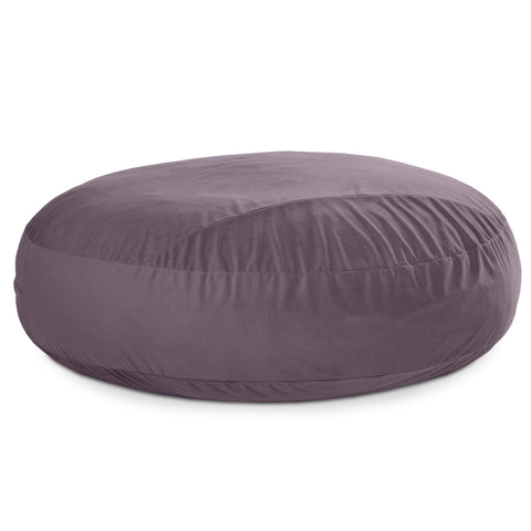 Round purple bean bag chair on a white background